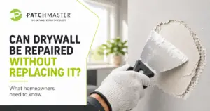 Professional drywall repair being completed on a damaged wall without replacing the entire drywall section.